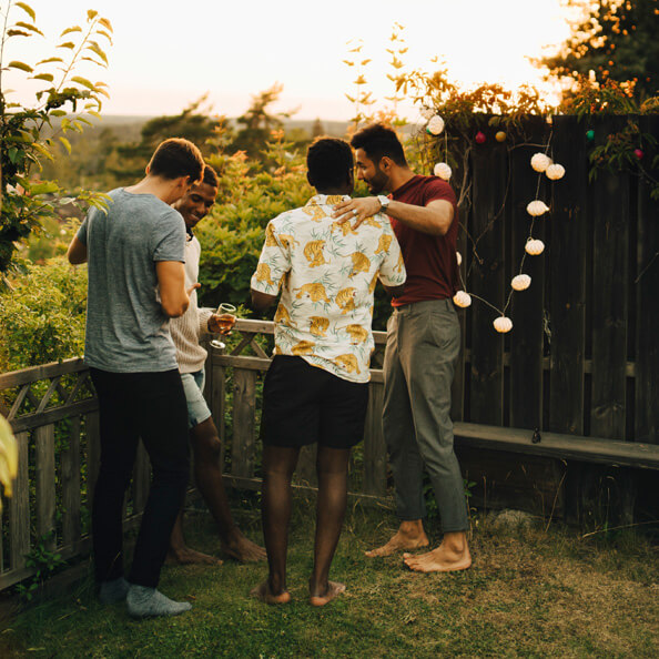 four guys at a backyard party